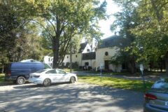 Chelsea, exterior from the parking area (house partly hidden, cars in frame)